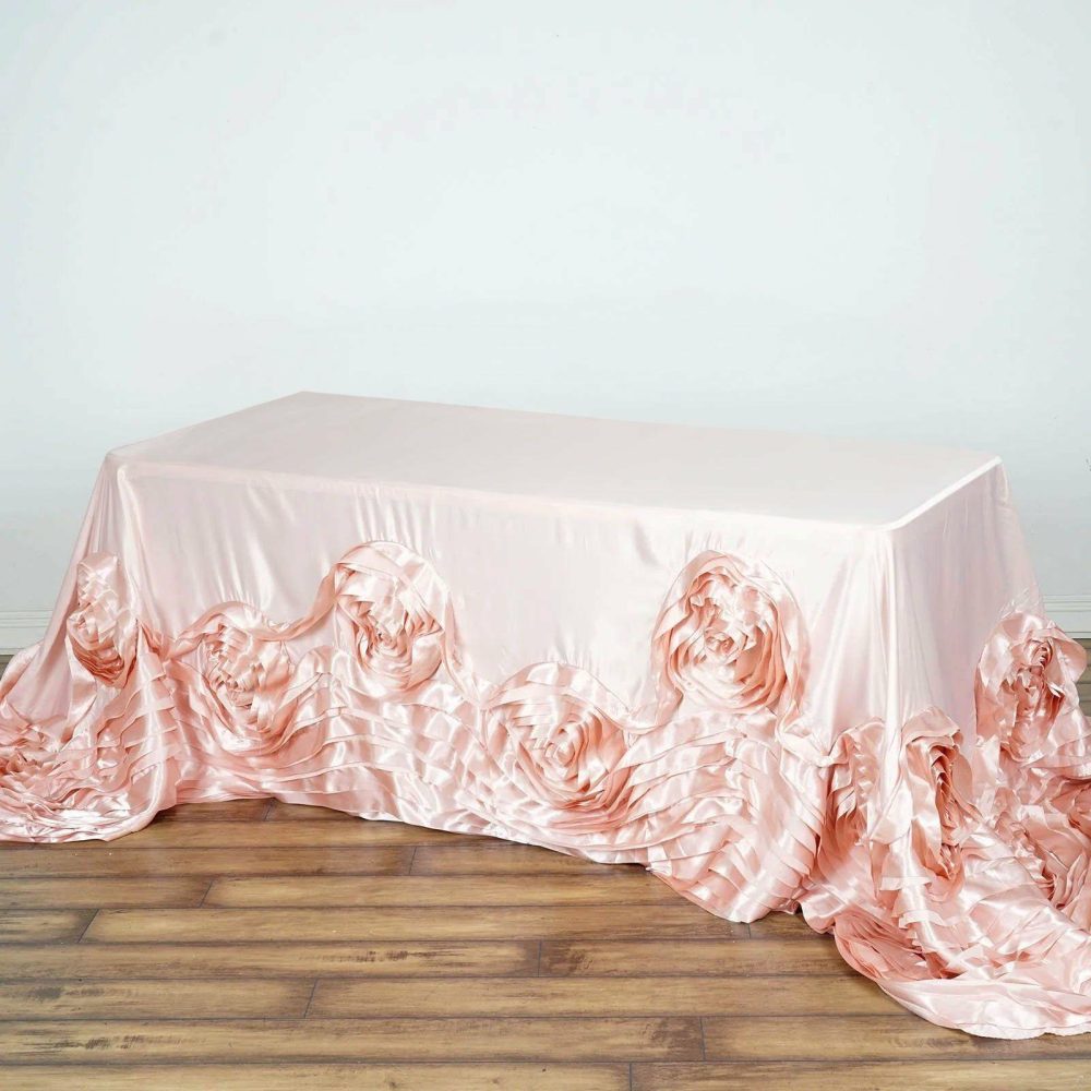 Blush Seamless Large Rosette Rectangular Lamour Satin Tablecloth 90″x132″ for 6 Foot Table With Floor-Length Drop  |   Rosette Rosette Blush