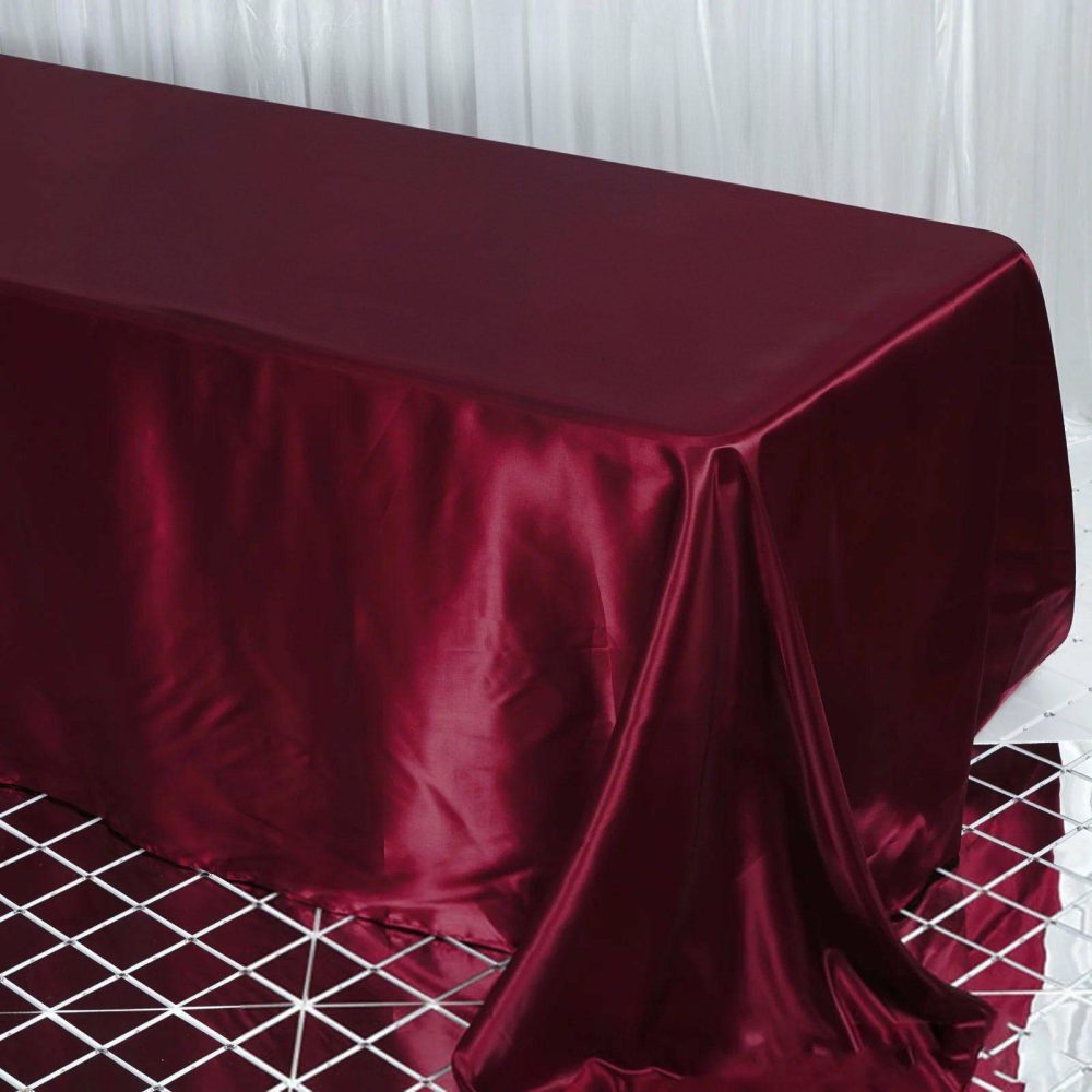 Burgundy Satin Seamless Rectangular Tablecloth 90″x132″ for 6 Foot Table With Floor-Length Drop  |   Satin Satin Burgundy