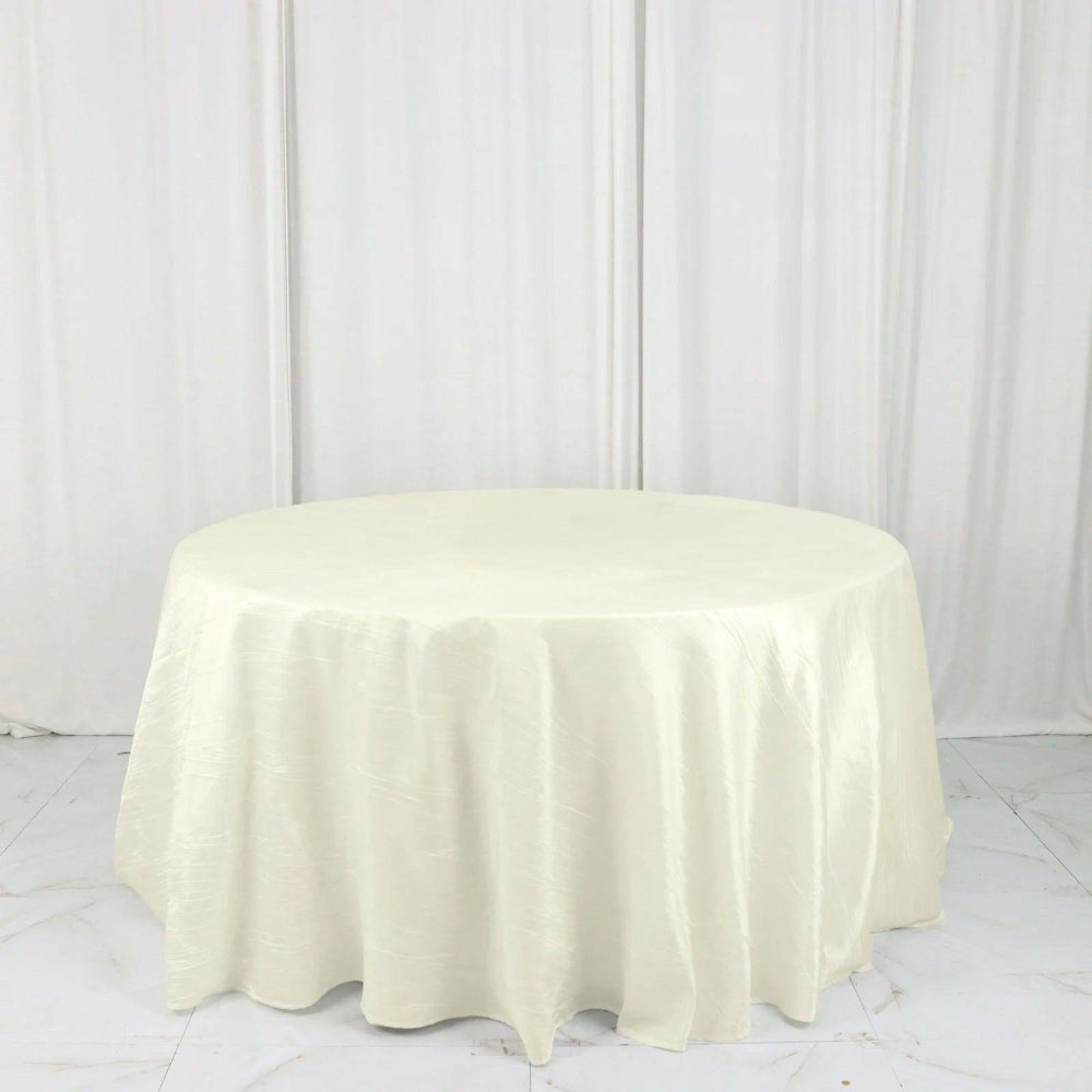 Ivory Accordion Crinkle Taffeta Seamless Round Tablecloth 132″ for 6 Foot Table With Floor-Length Drop  |   Pintuck, Crinkle & Leaf Pintuck, Crinkle & Leaf Ivory