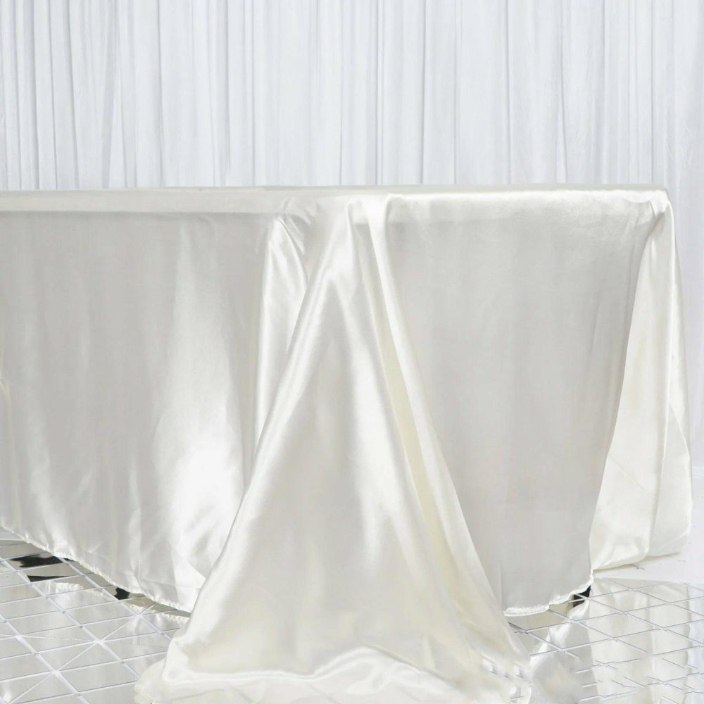 Ivory Seamless Satin Rectangular Tablecloth 90″x156″ for 8 Foot Table With Floor-Length Drop  |   Satin Satin Ivory