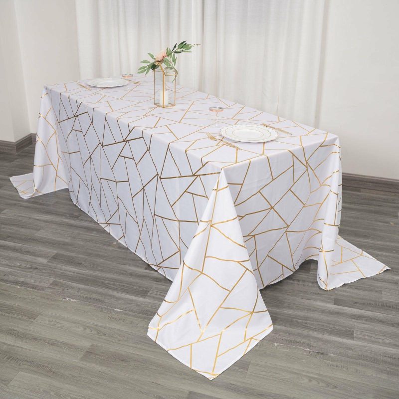 White Seamless Rectangle Polyester Tablecloth With Gold Foil Geometric Pattern 90″x132″ for 6 Foot Table With Floor-Length Drop  |   Polyester Polyester Polyester